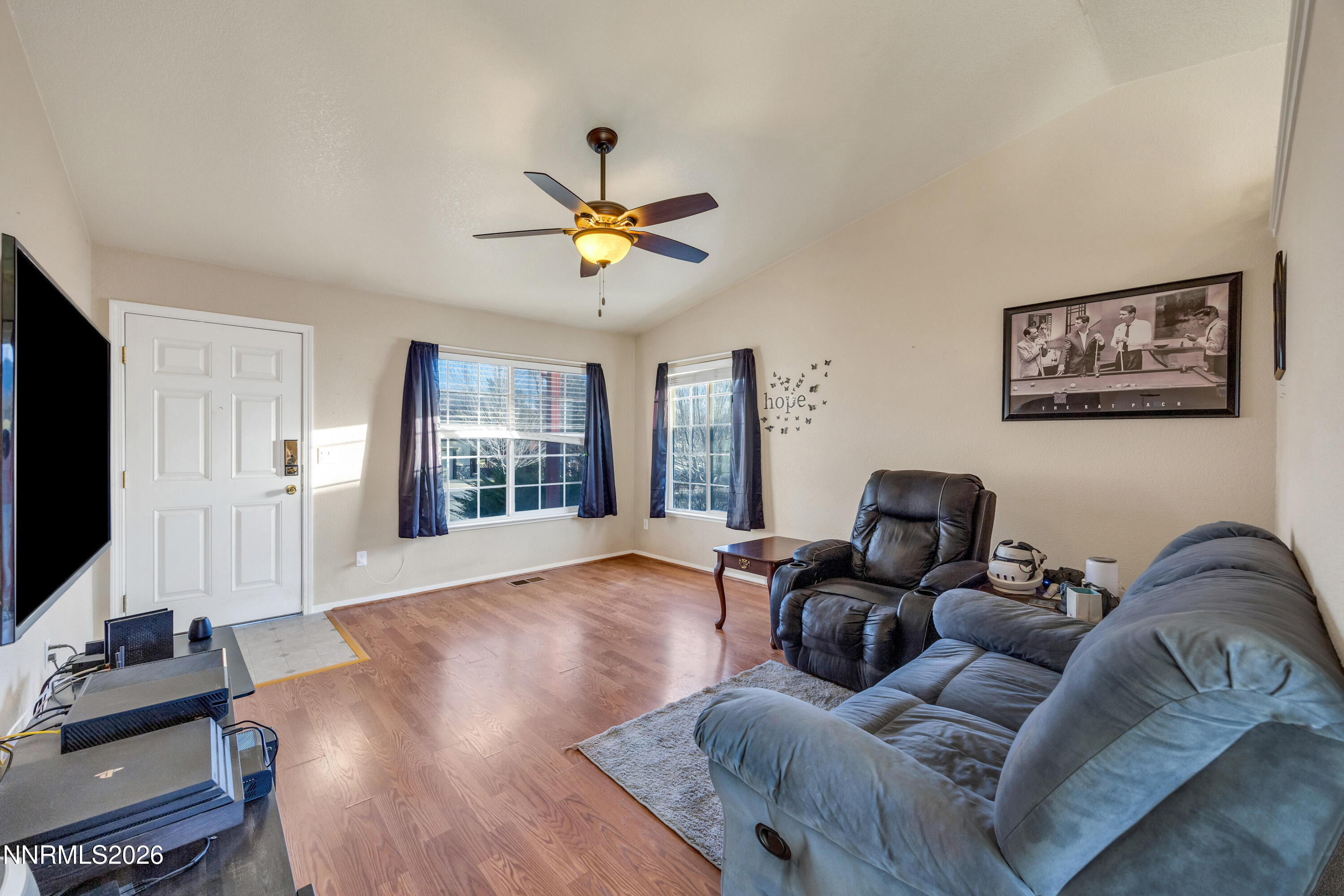 17391 Desert Lake Drive Reno, NV 89508 - Photo 8 of 39 a living room with furniture and a flat screen tv