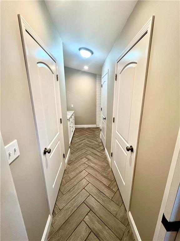 375 Old Rt 21 Road McClellandtown, PA 15458 - Photo 20 of 39 a view of a hallway with wooden floor and staircase