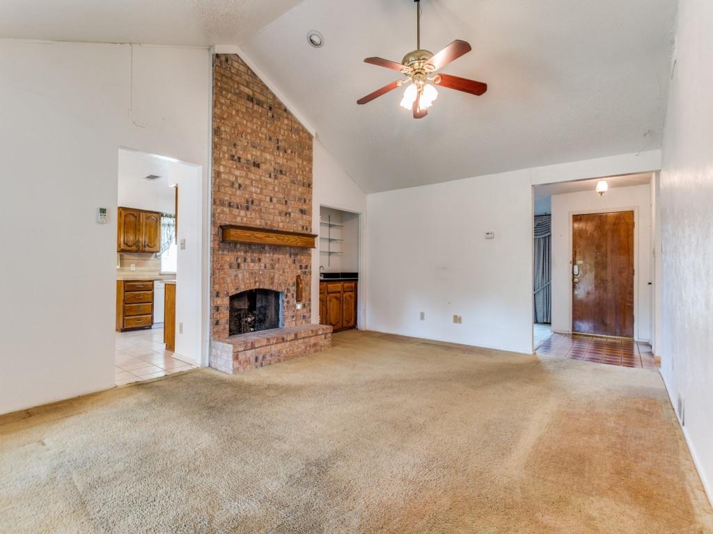 1807 Eldora Court Richardson, TX 75081 - Photo 11 of 23 a view of a livingroom with a fireplace a chandelier fan and a fireplace
