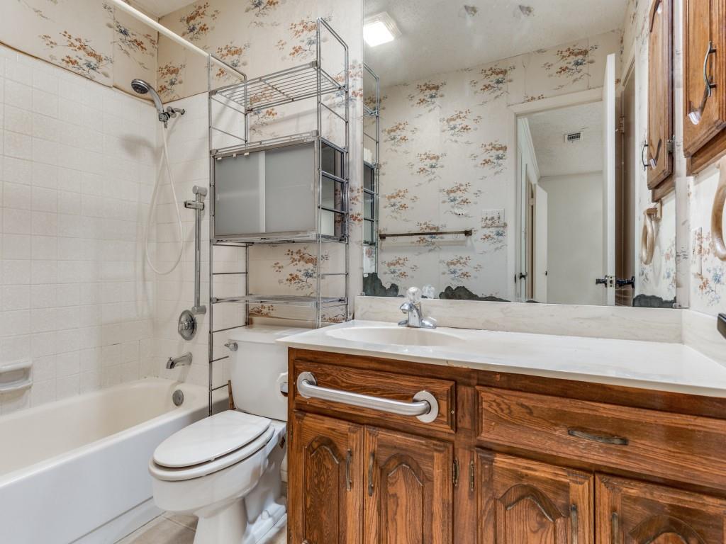 1807 Eldora Court Richardson, TX 75081 - Photo 16 of 23 a bathroom with a sink a toilet and shower