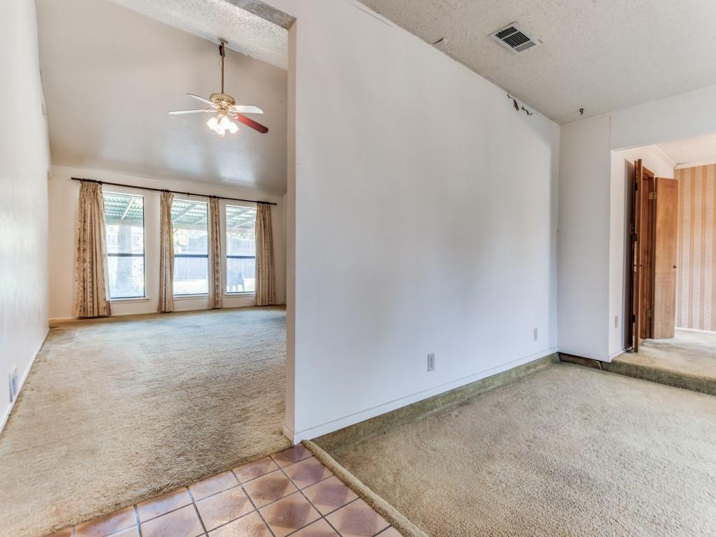 1807 Eldora Court Richardson, TX 75081 - Photo 9 of 23 an empty room with chandelier fan and windows