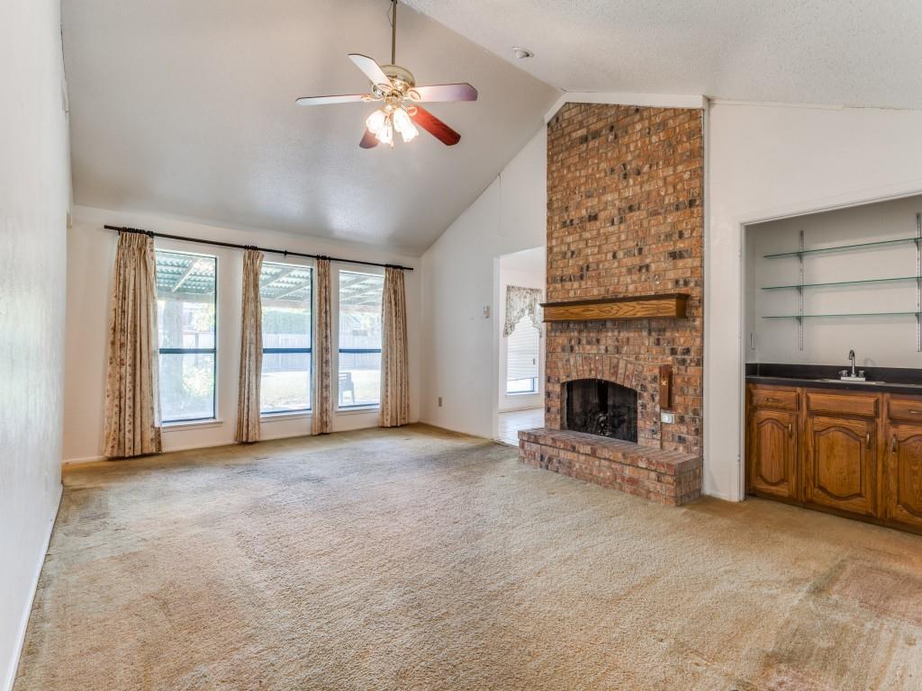 1807 Eldora Court Richardson, TX 75081 - Photo 10 of 23 a view of an empty room with a fireplace and a window