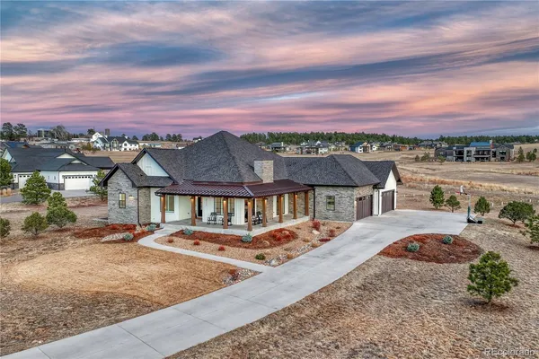an aerial view of multiple houses with yard