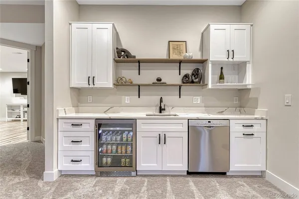 a view of a livingroom with furniture and a flat screen tv