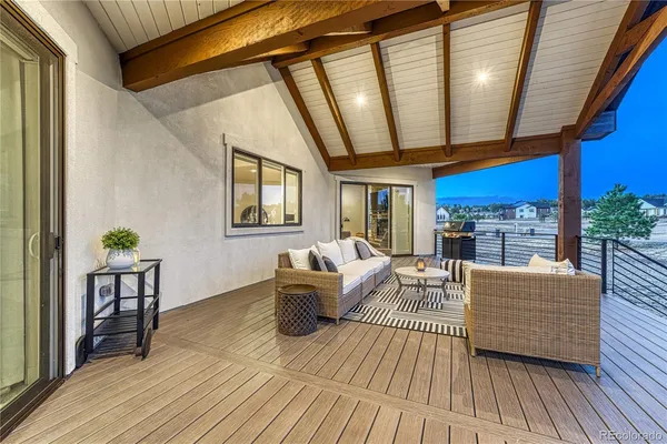 a view of a patio with a table and chairs