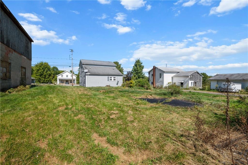 2019 Mercer West Middlesex Road Mercer, PA 16137 - Photo 15 of 17 a view of a garden with a building in the background
