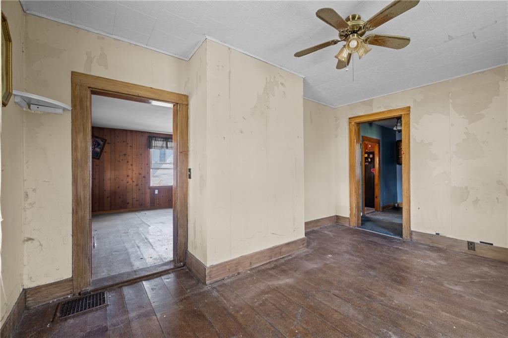 2019 Mercer West Middlesex Road Mercer, PA 16137 - Photo 8 of 17 a view of a hallway with wooden floor and a ceiling fan