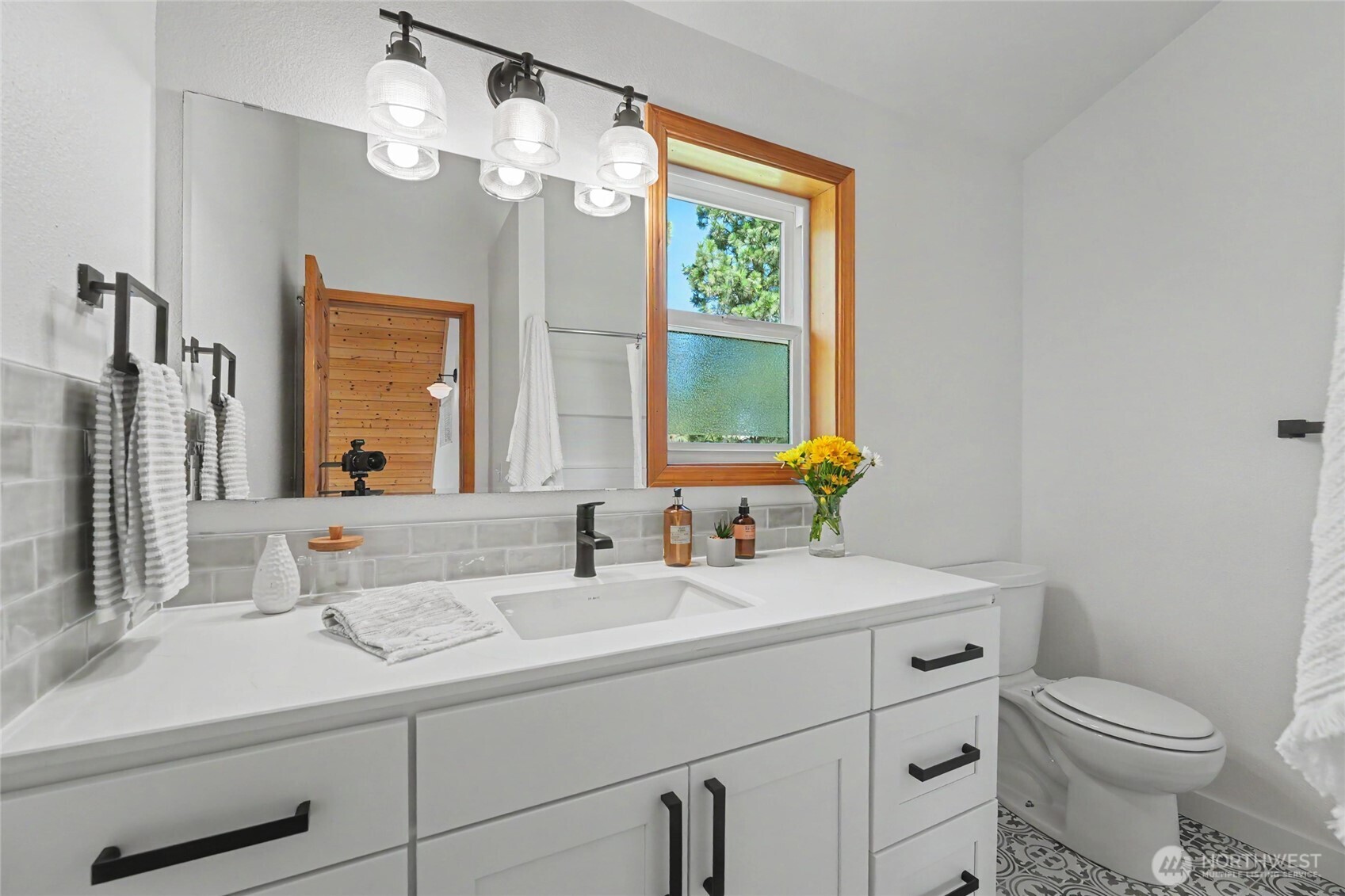 93 Golf Course Drive Pateros, WA 98846 - Photo 20 of 34 a bathroom with a sink a toilet and a mirror