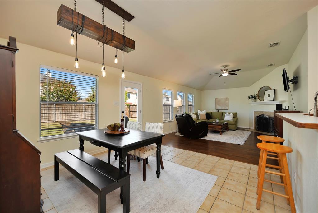 1333 Missionary Ridge Trail Fort Worth, TX 76131 - Photo 15 of 31 a living room with furniture a rug and a chandelier