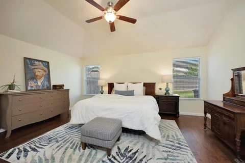 a bedroom with a bed and a dresser