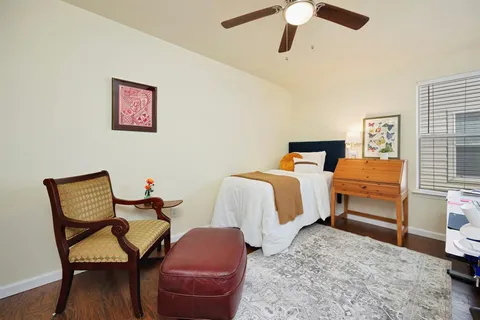 a bedroom with furniture and a bed