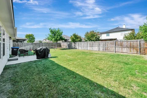 a view of a backyard with a garden