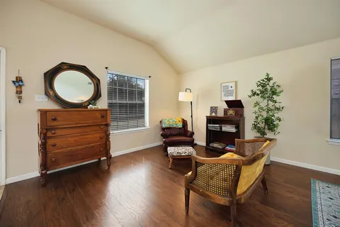 a room with furniture and wooden floor