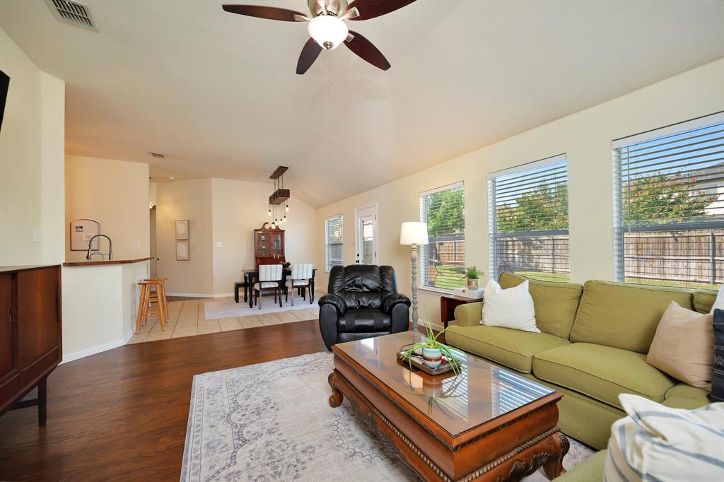 1333 Missionary Ridge Trail Fort Worth, TX 76131 - Photo 8 of 31 a living room with furniture a wooden floor and a large window