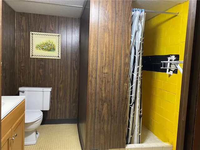 a bathroom with a toilet and shower