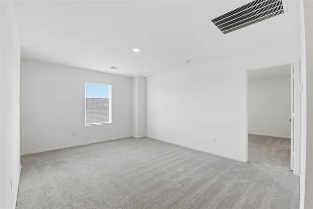 an empty room with a empty space and a window