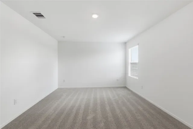a view of room with window and hardwood floor
