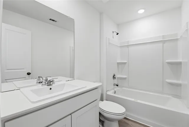 a bathroom with a sink a toilet and a bathtub