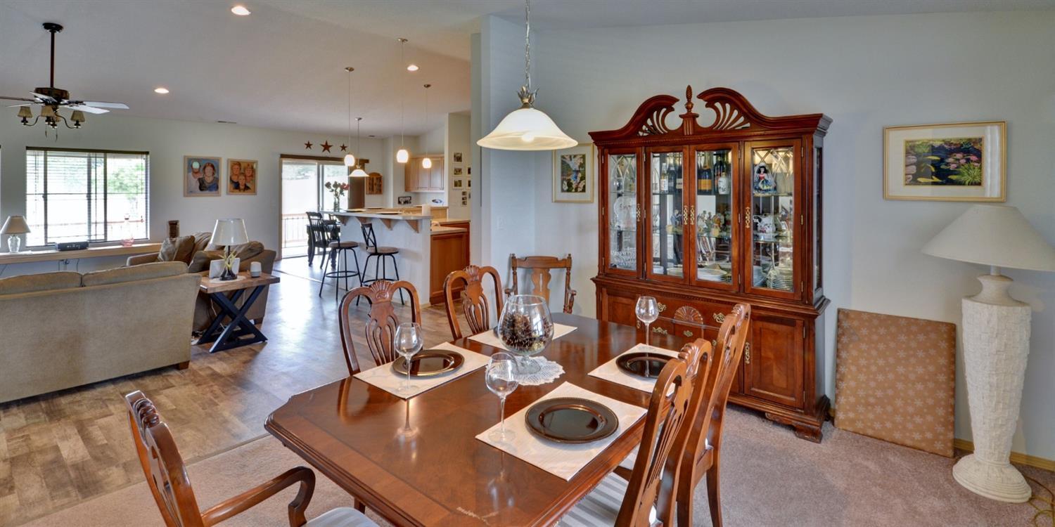 14731 Avalon Road White City, OR 97503 - Photo 7 of 34 a view of a dining room with furniture a chandelier and wooden floor