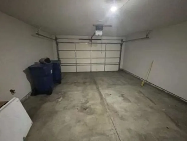 a view of house that has windows and a door