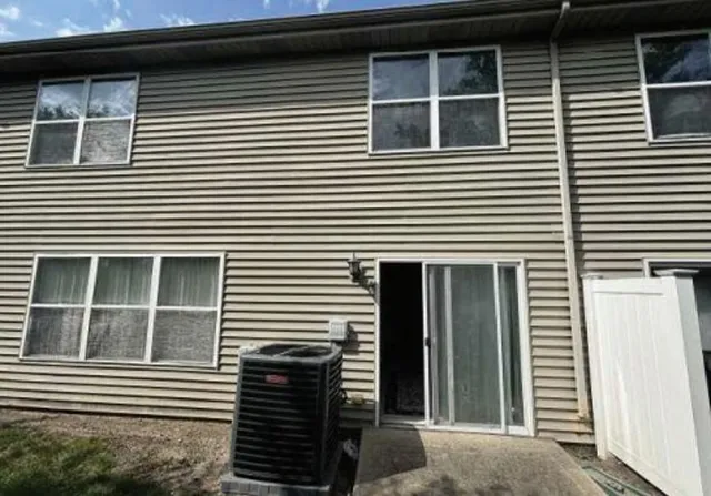 a backyard of a house with lots of green space