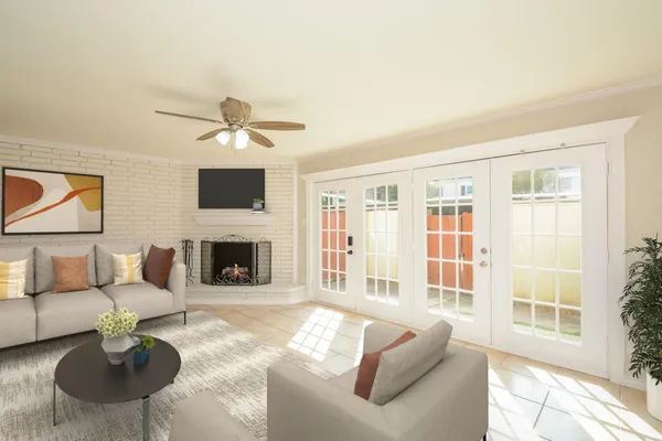 a living room with furniture a fireplace and a flat screen tv