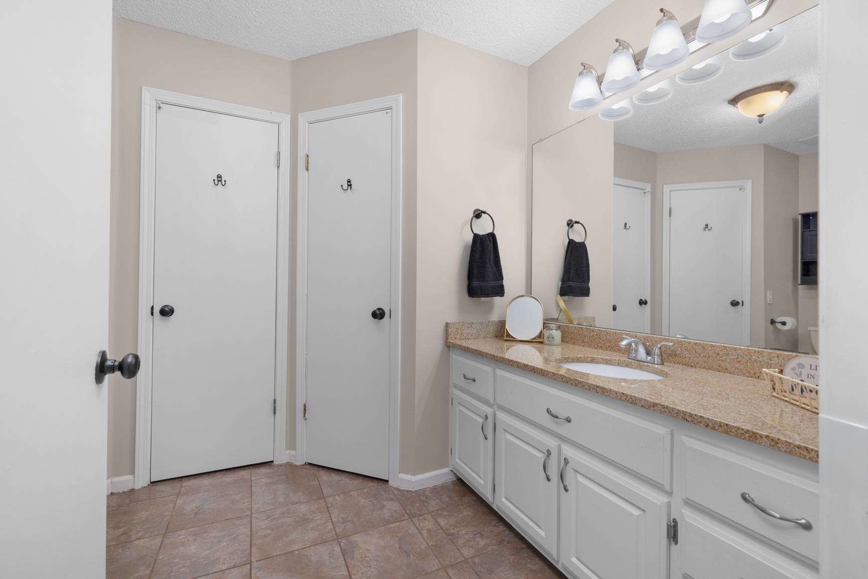 284 Pwr Loop Munford, TN 38058 - Photo 18 of 36 Bathroom with vanity and a textured ceiling