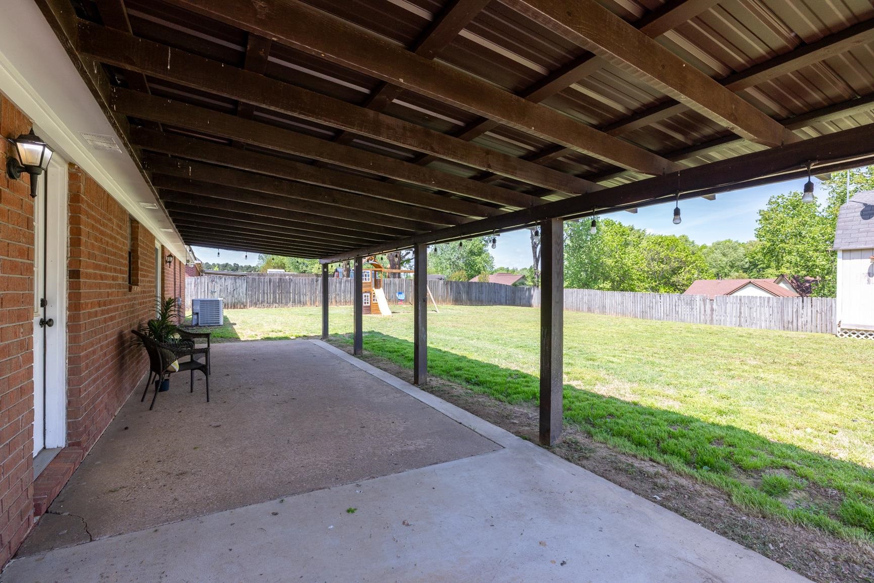 284 Pwr Loop Munford, TN 38058 - Photo 32 of 36 Fenced backyard with a patio