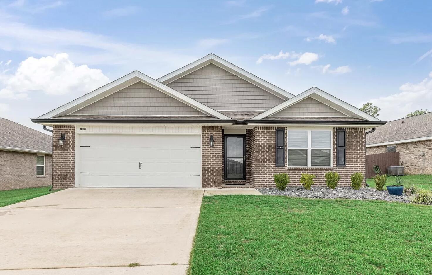 a view of a house with garden