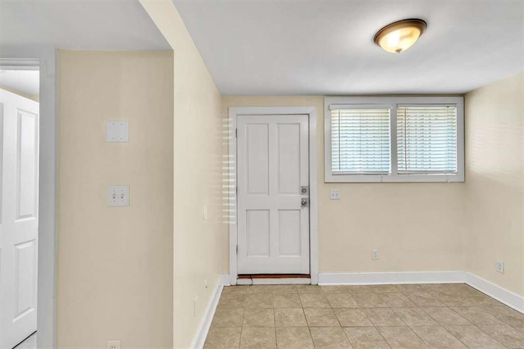 209 East Duffy Street, Unit A Savannah, GA 31401 - Photo 12 of 17 a view of an empty room with a window