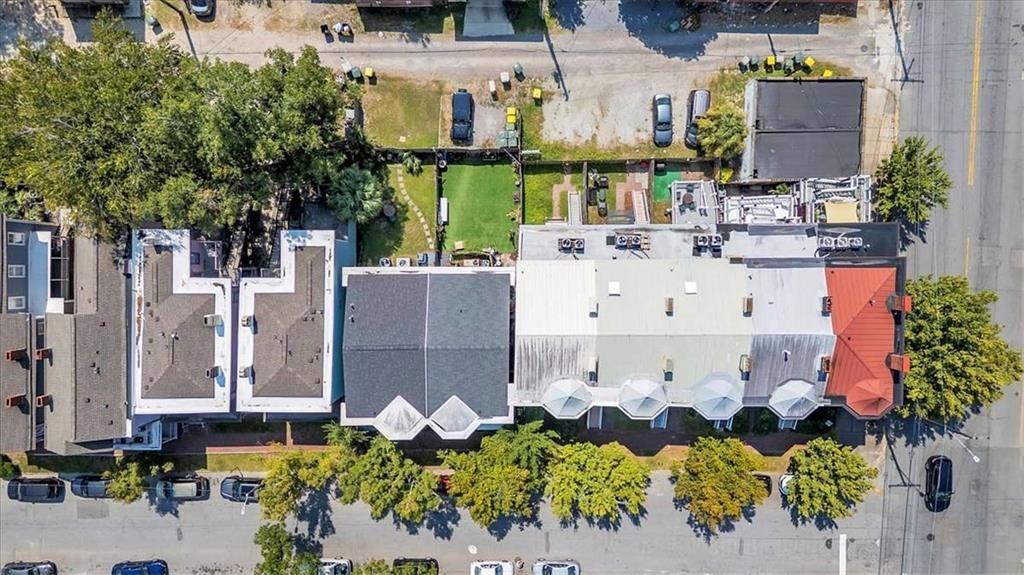 209 East Duffy Street, Unit A Savannah, GA 31401 - Photo 15 of 17 a building with flowers in front of it