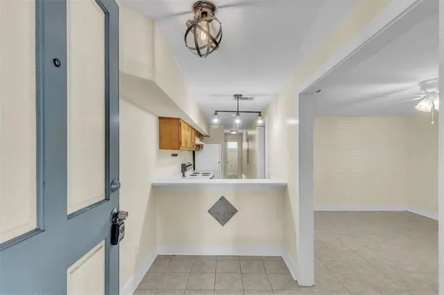 a view of a kitchen with a sink and cabinets