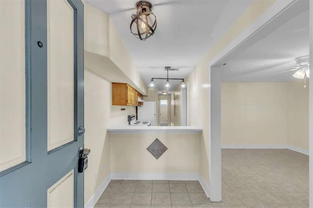 209 East Duffy Street, Unit A Savannah, GA 31401 - Photo 3 of 17 a view of a kitchen with a sink and cabinets