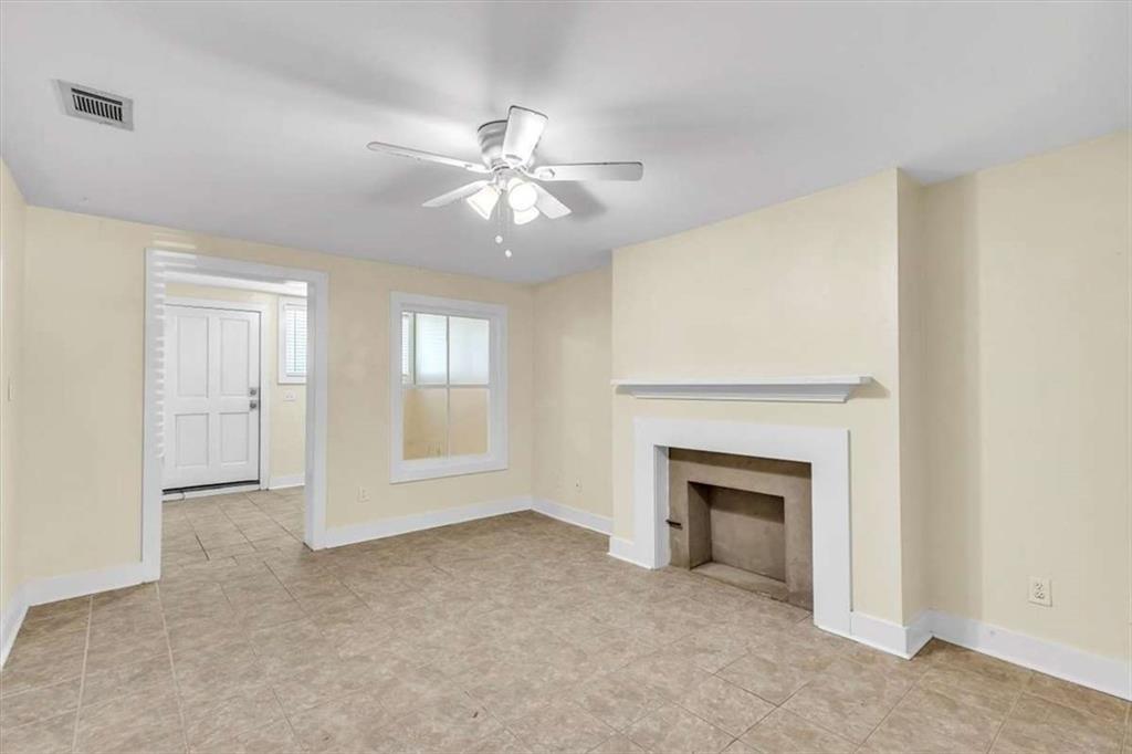 209 East Duffy Street, Unit A Savannah, GA 31401 - Photo 6 of 17 a view of empty room with fireplace