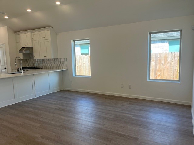 2139 Mosaic Vly Court Angleton, TX 77515 - Photo 7 of 14 a view of kitchen and window with wooden floor