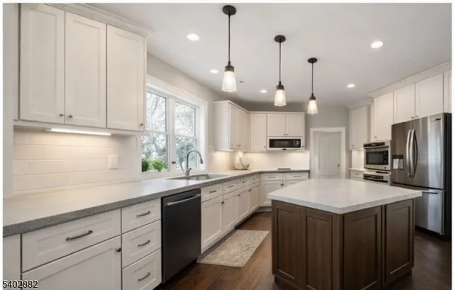 a view of walk in closet with clothes