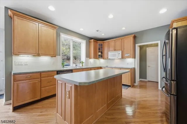 a spacious bathroom with a sink double vanity shower and a mirror