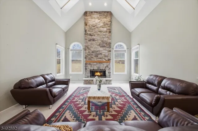 a kitchen with stainless steel appliances granite countertop a sink a stove and a refrigerator