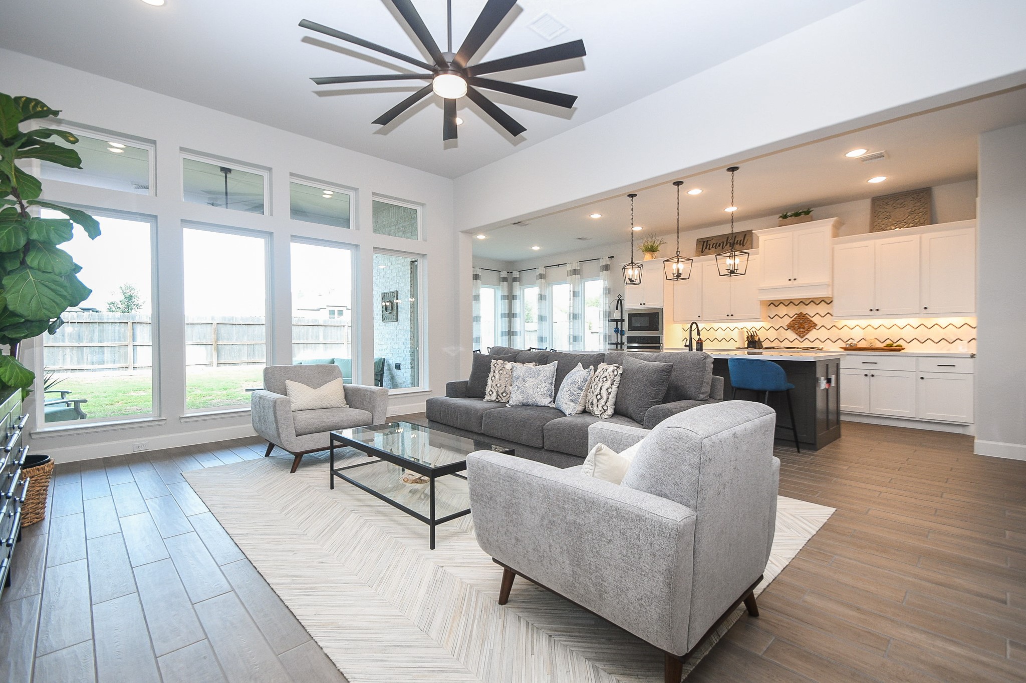 30314 Brook Point Fulshear, TX 77441 - Photo 1 of 38 Welcome to your open-concept gathering place, with ample natural light and space.