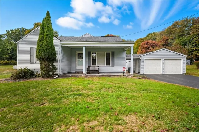 a view of a house with a backyard