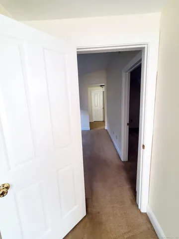 a view of a hallway with closet