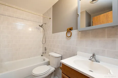 a bathroom with a shower and a toilet