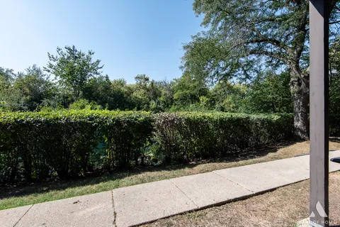 a view of a backyard with sitting area