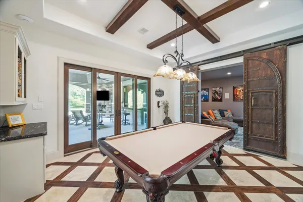 a view of a patio with table and chairs potted plants with wooden floor