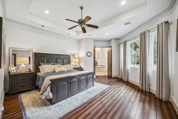 a living room with a chandelier and fireplace
