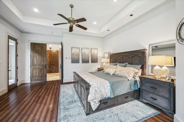 a bathroom with a granite countertop sink and a bathtub