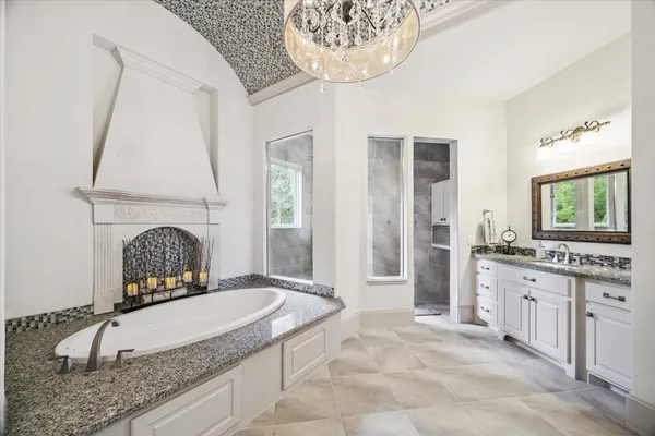 a bathroom with a bathtub and a shower