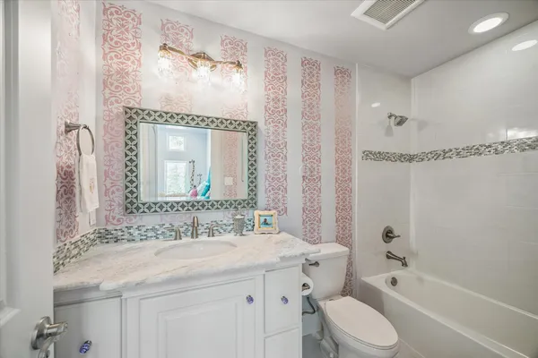 a view of a house with backyard and porch