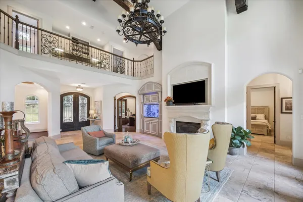 a living room with fireplace furniture and a flat screen tv