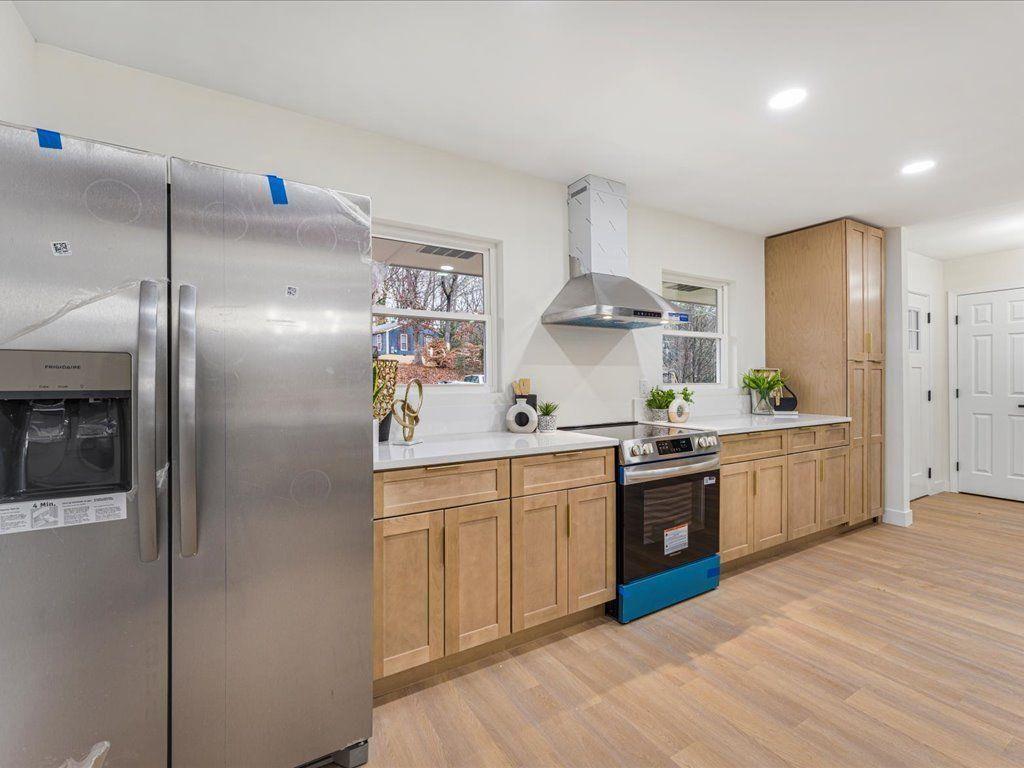 2874 Cocklebur Cove Court Decatur, GA 30034 - Photo 11 of 36 a large kitchen with stainless steel appliances granite countertop a sink a stove and a refrigerator
